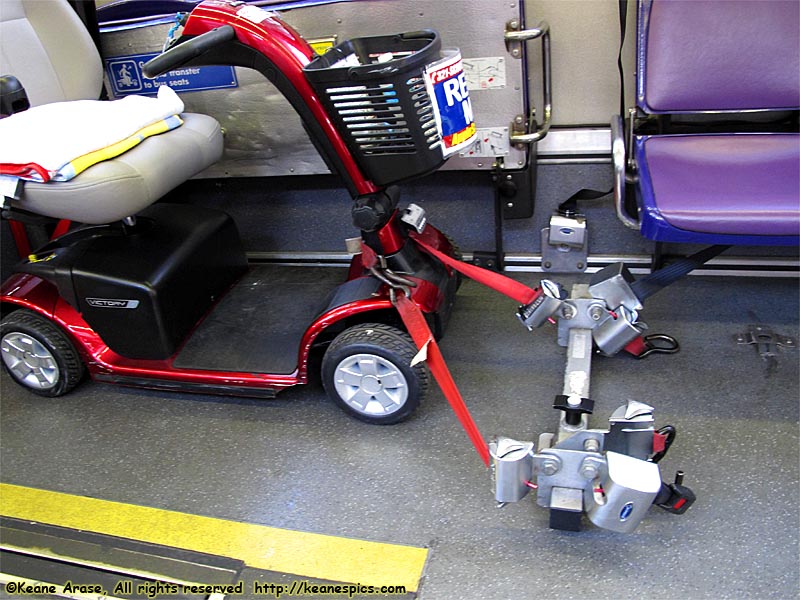 Scooter tie-down on bus